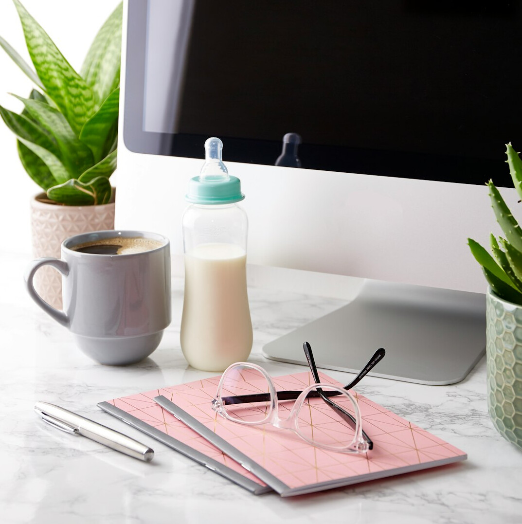 Desk with laptop and notebook