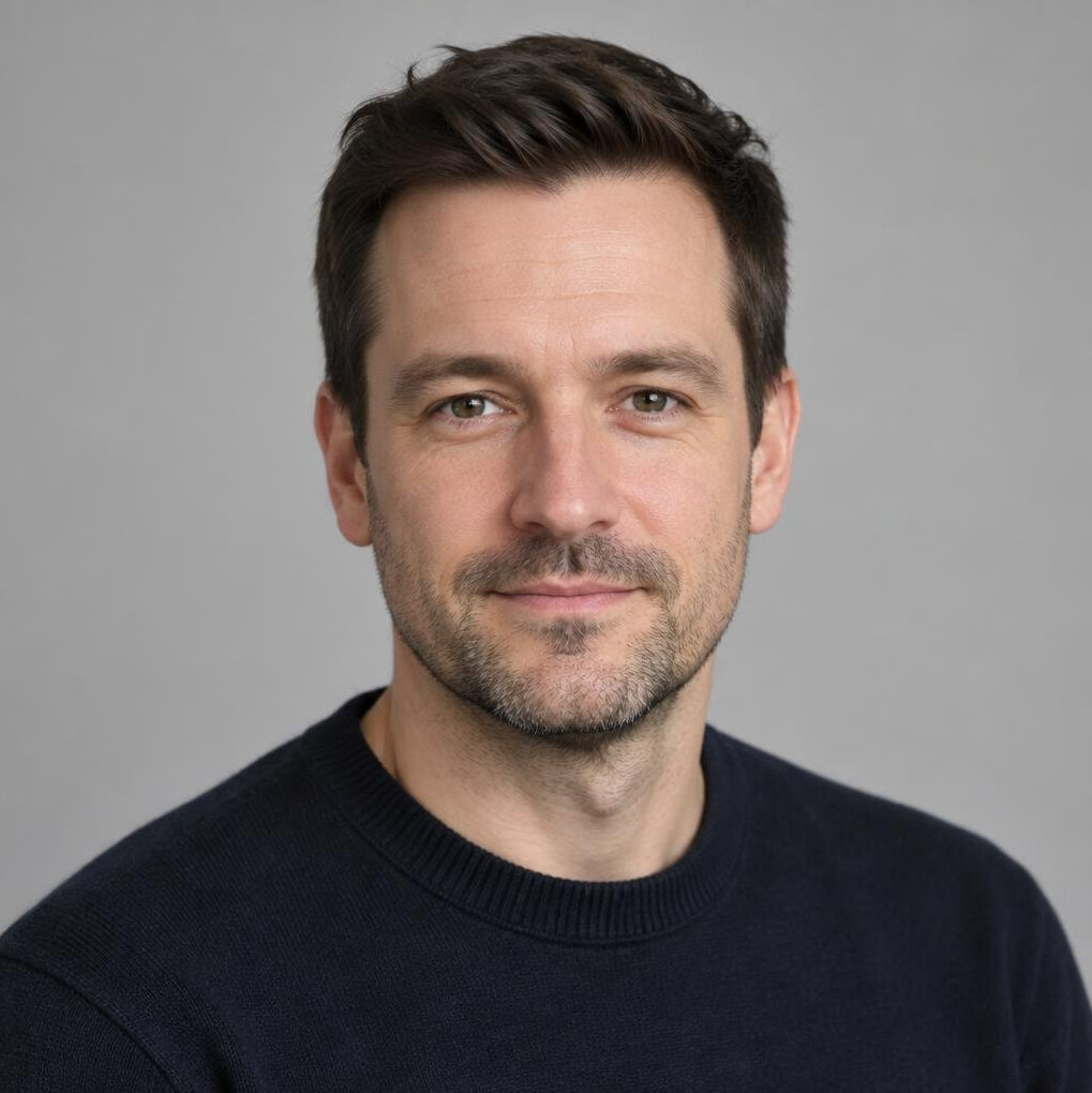 Portrait of a man in his thirties with short dark hair